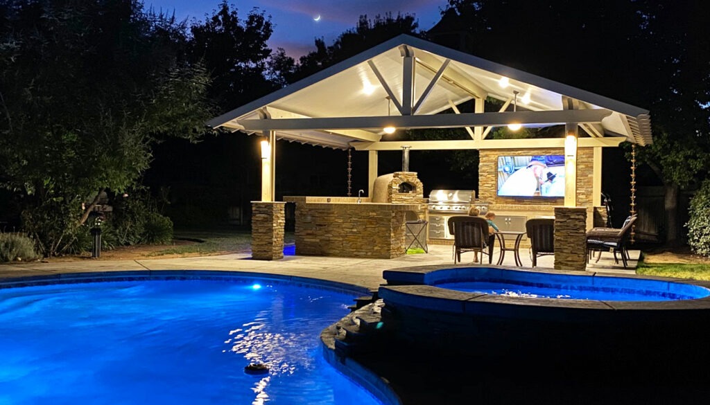 outdoor patio with patio cover, grill and pool
