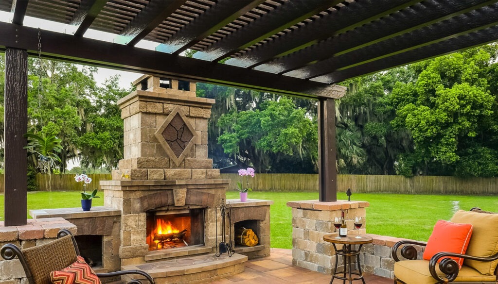 outdoor patio with patio cover and stone fireplace