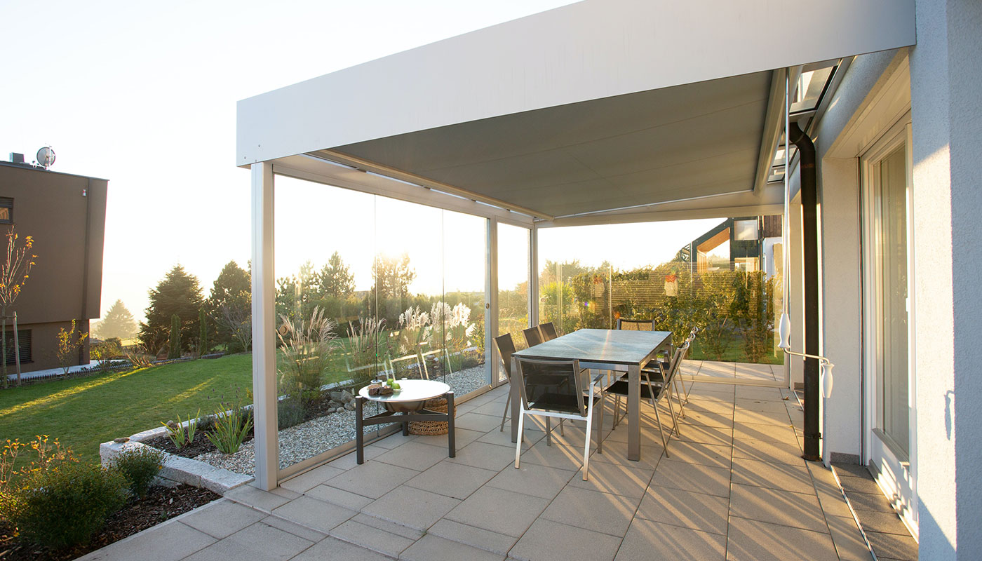 outdoor patio with roll-formed patio cover and patio furniture