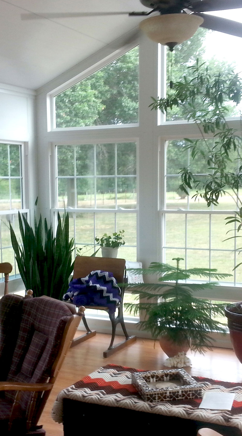 inside of enclosed sunroom with furniture
